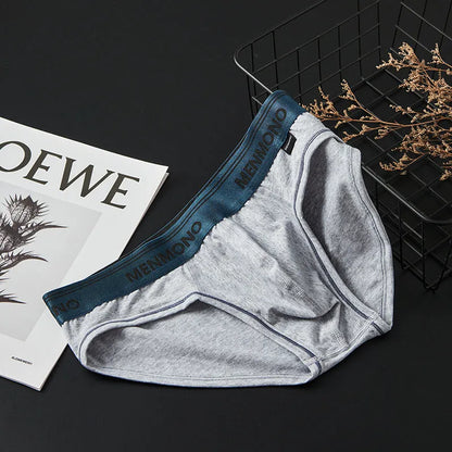 Men's low waist cotton briefs in a two-tone colour option on a plain background