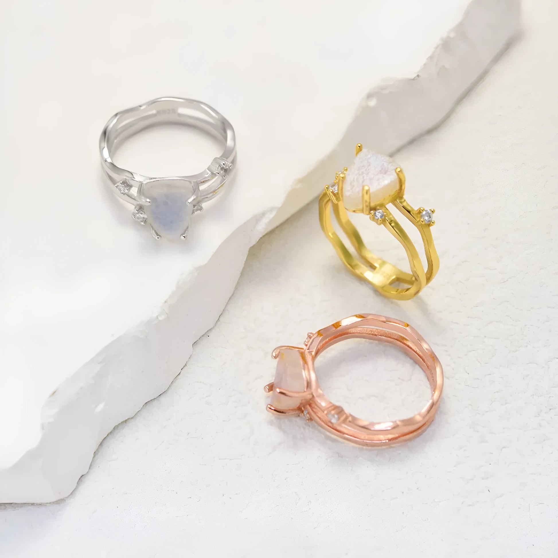 S925 sterling silver irregular triangle moonstone ring showing geometric design and 12mm gemstone centrepiece