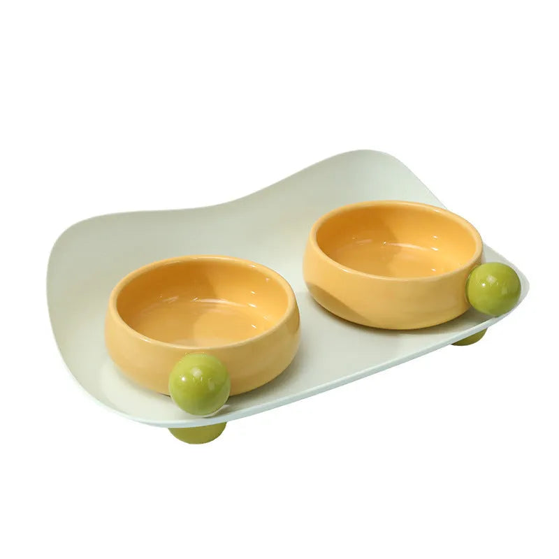 Ceramic raised pet bowl set with two bowls and non-slip base in pink, yellow and pink-yellow colours