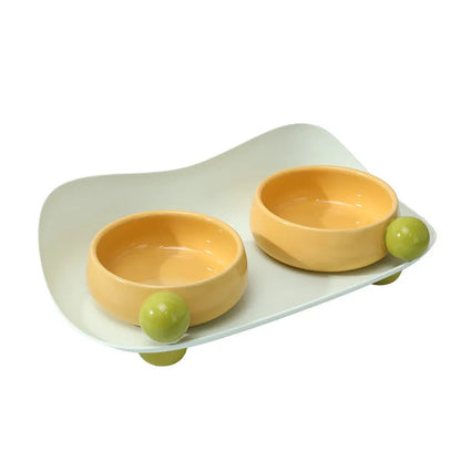 Ceramic raised pet bowl set with two bowls and non-slip base in pink, yellow and pink-yellow colours