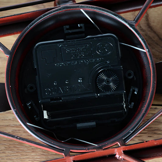 Vintage wrought iron airplane wall clock with glass face measuring 47cm wide