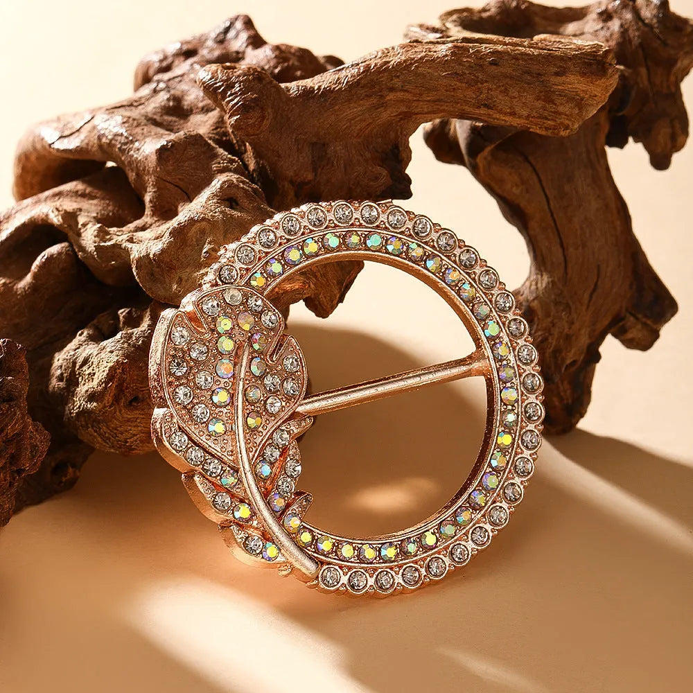 Bow-shaped waist-cinching accessory clip for high-end brooches, alloy with electroplating and diamond inlay, shown in gold, silver, or rose gold finishes.
