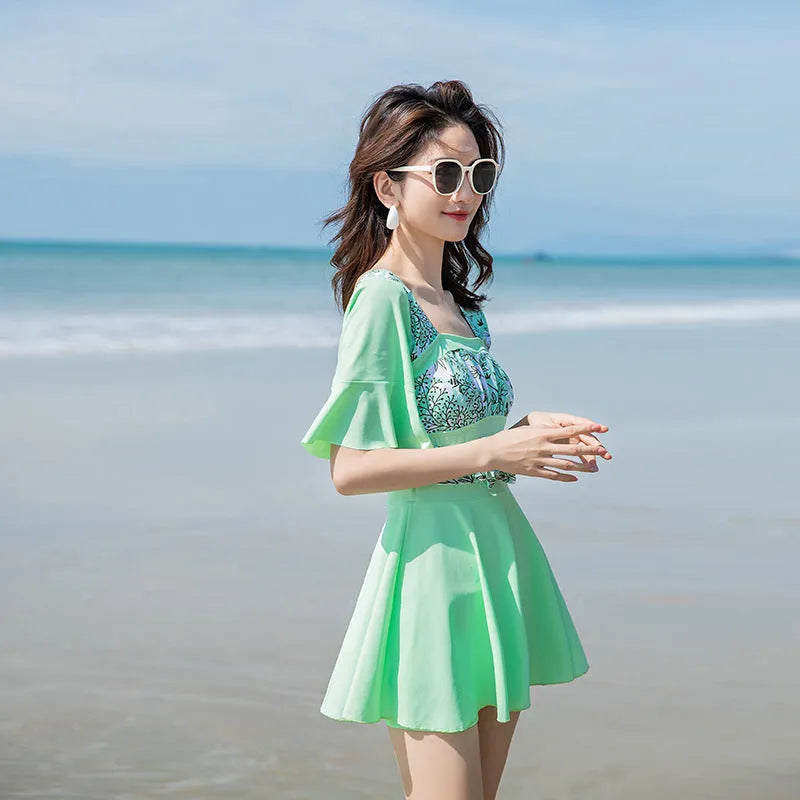 Women's seaside printed one-piece swimsuit in chemical fibre blend fabric available in green and blue colours