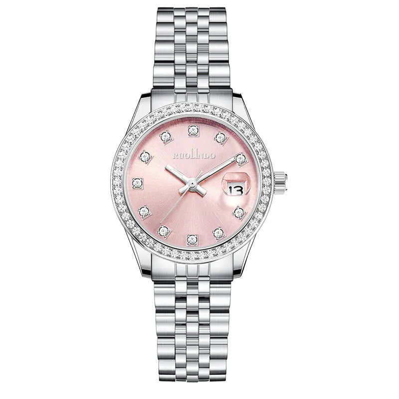 Women's silver alloy calendar watch with quartz movement and stainless steel buckle on wrist.