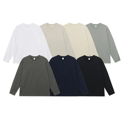 Man wearing a simple solid colour long sleeve cotton t-shirt in a loose, casual fit.