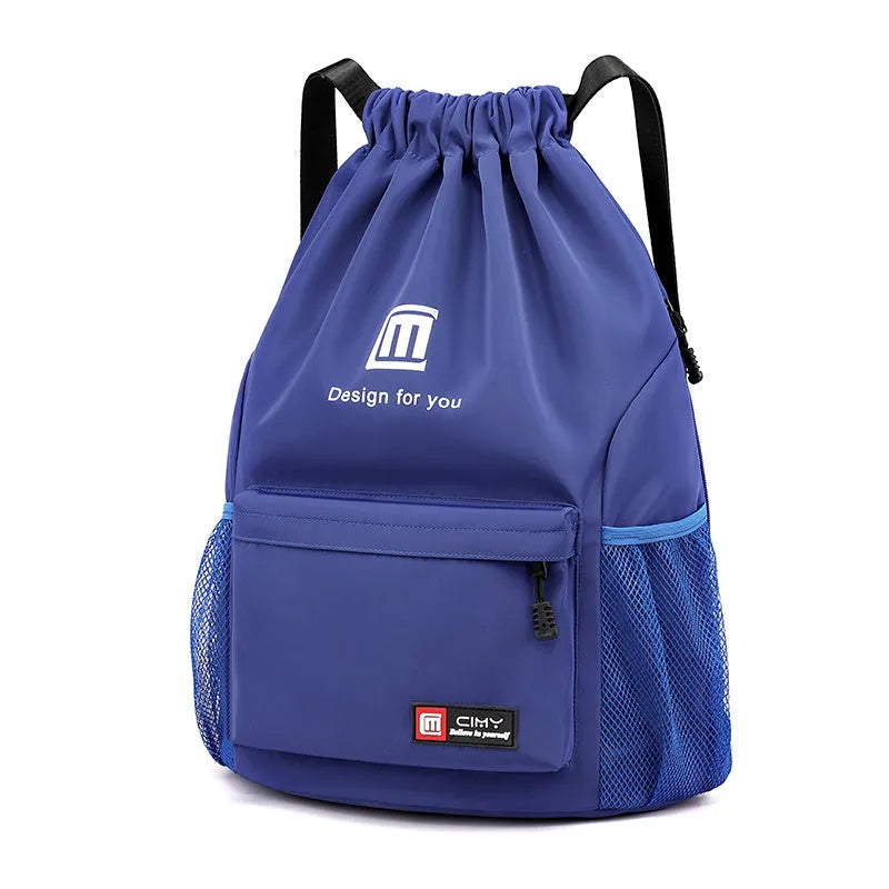Large bucket-shaped travel backpack in blue with drawstring closure and soft black shoulder straps.
