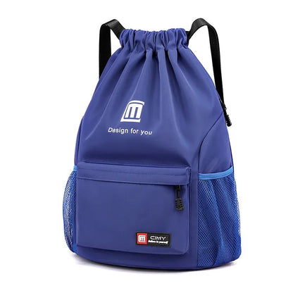 Large bucket-shaped travel backpack in blue with drawstring closure and soft black shoulder straps.