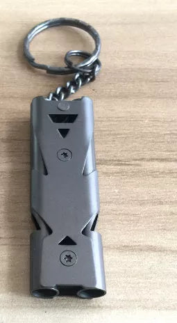 Durable metal keychain whistle in silver and black, compact design for safety