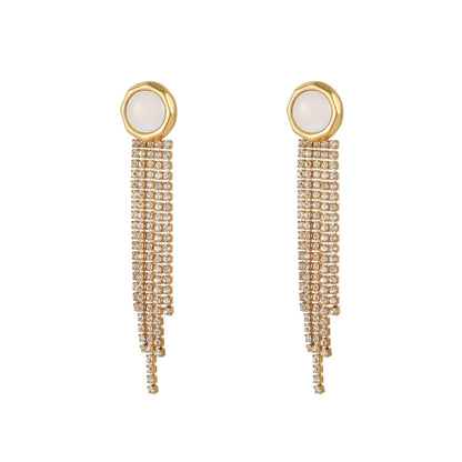 Gold-coloured women's earrings with a love heart shape, star details and dangling diamond-style tassels on a white background.