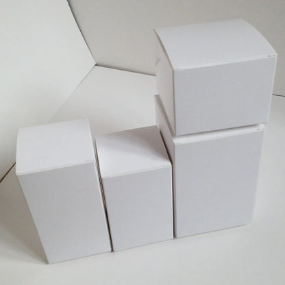 White paper storage boxes showing size variations from 3x3cm to 10x10cm base with different height options