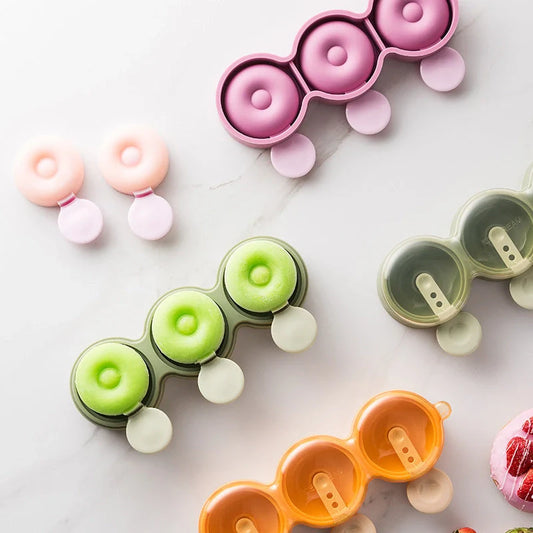 Food grade silicone doughnut ice cream mold in yellow, green, and purple