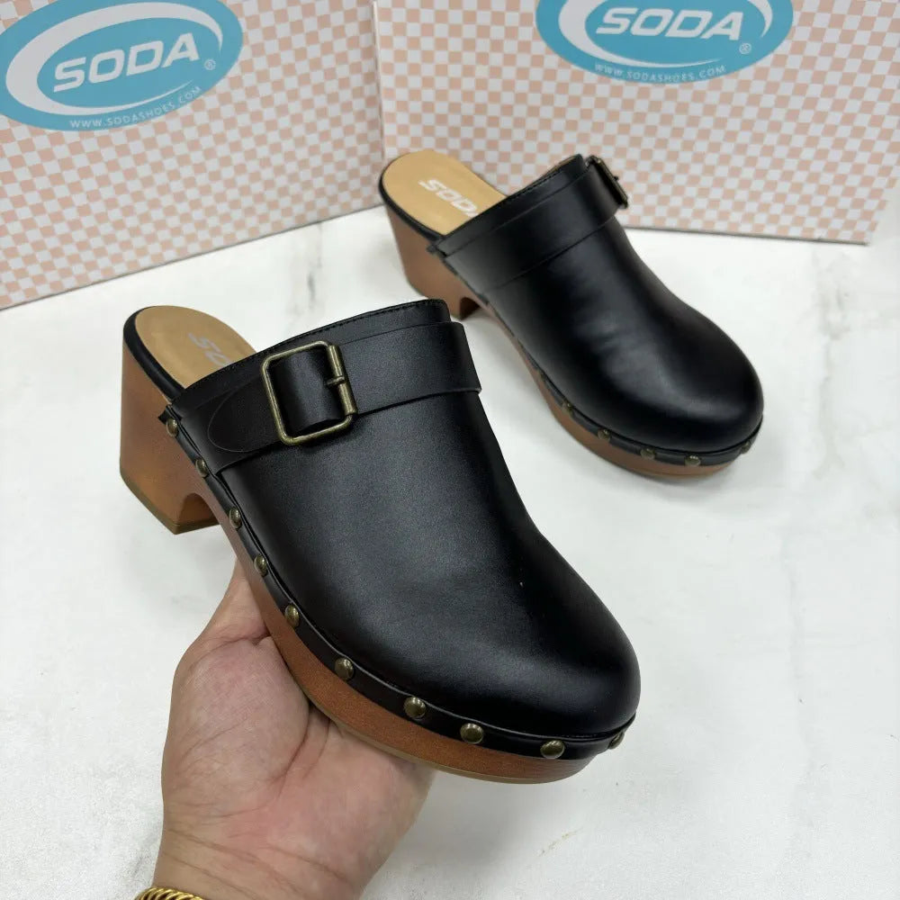 Women's black retro chunky heel slippers with closed toe, rivet details, and a rubber sole.