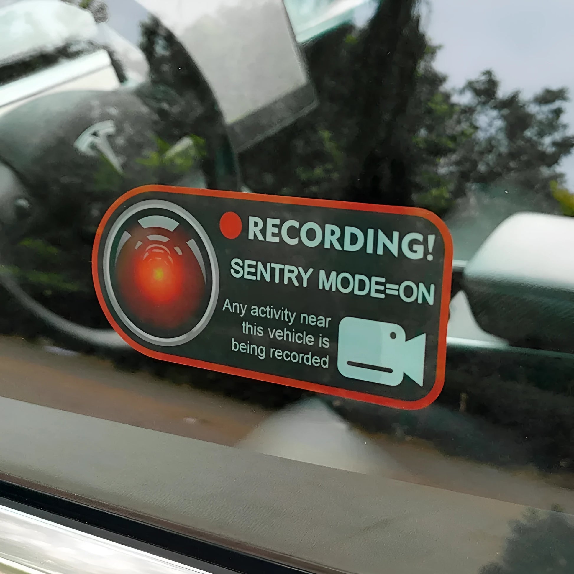 Tesla Sentry Mode electrostatic warning sticker measuring 11cm by 5cm with English security text