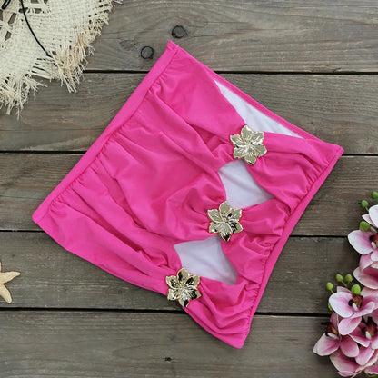 Solid colour women's one-piece swimsuit with hollow-out tube top and detachable short skirt on a mannequin.