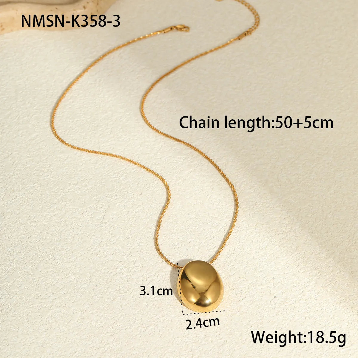 Gold-toned geometric pendant necklace on a chain, showing adjustable length between 41 cm and 50 cm.