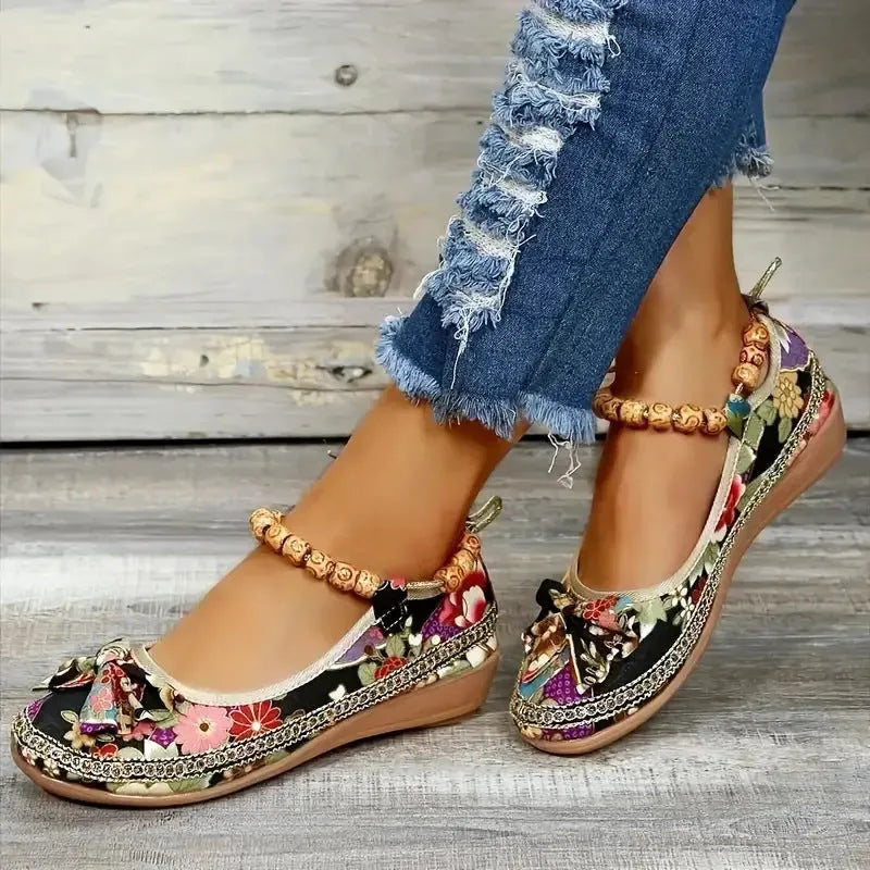Women's black plus size ethnic style platform sandals with elastic band and cloth upper.