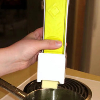 Yellow ABS plastic butter cutter with stainless steel blades for quarter-pound stick butter bars