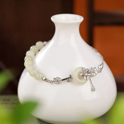 Hetian jade lotus peace buckle bracelet in 925 silver with gold plating, antique retro style