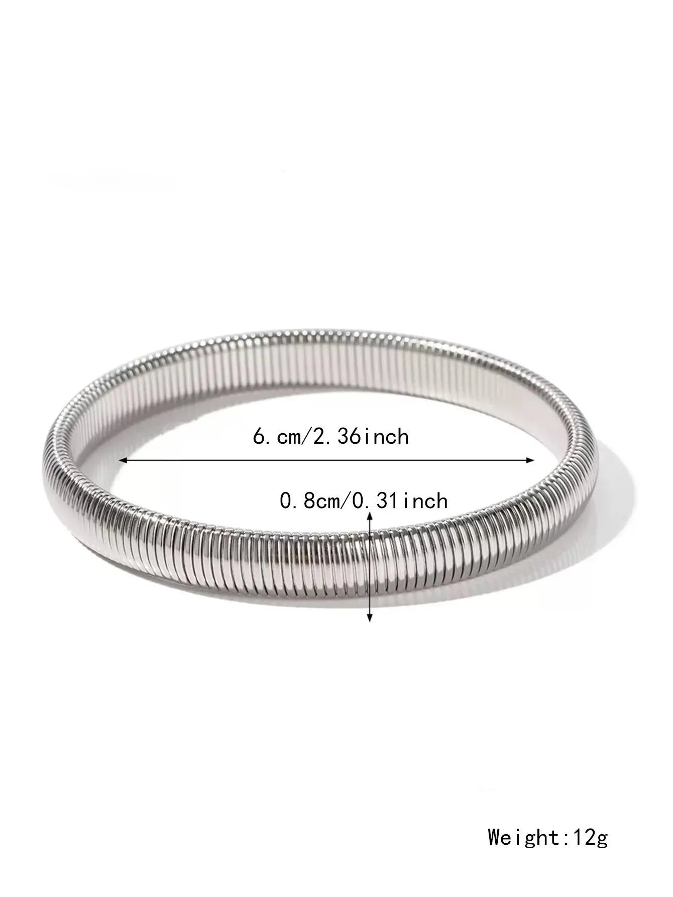 Women's titanium steel elastic bracelet with a vertical stripe pattern in gold, shown on a wrist.