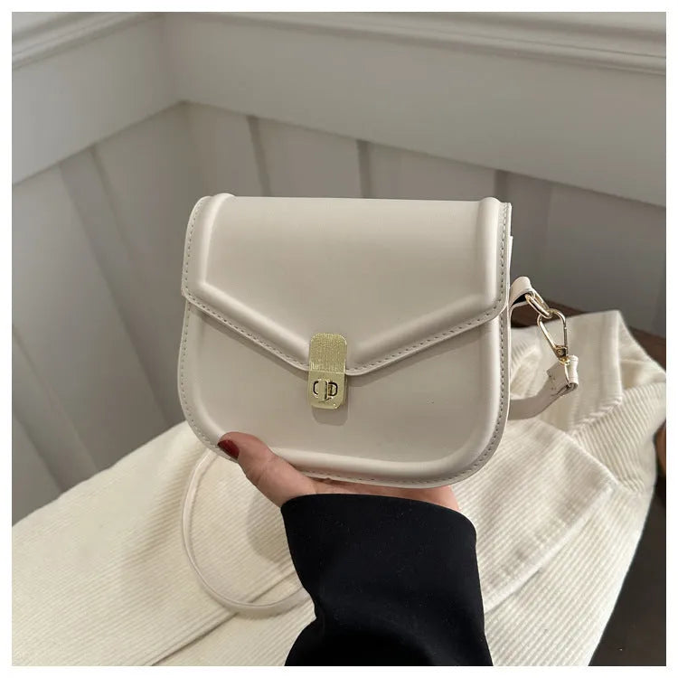 Soft PU leather messenger bag with clamshell opening in black, dark brown, khaki or white.
