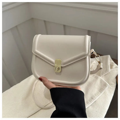 Soft PU leather messenger bag with clamshell opening in black, dark brown, khaki or white.
