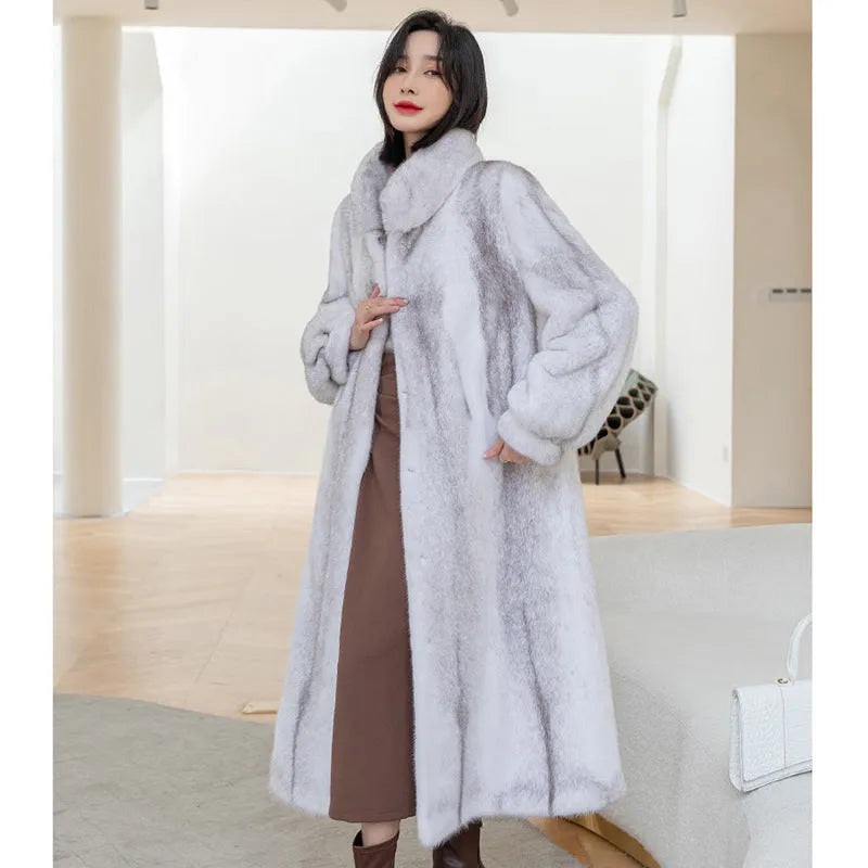 White women's faux fur coat with a stand-up collar, shown on a model.