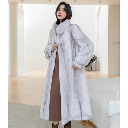 White women's faux fur coat with a stand-up collar, shown on a model.
