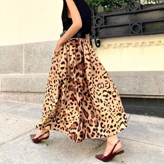 Brown leopard print A-line long skirt with 120cm hem, made from 100% polyester fabric, shown in sizes S to XL.
