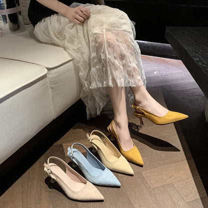 Apricot suede women's pointed-toe stiletto high heels on a plain background.