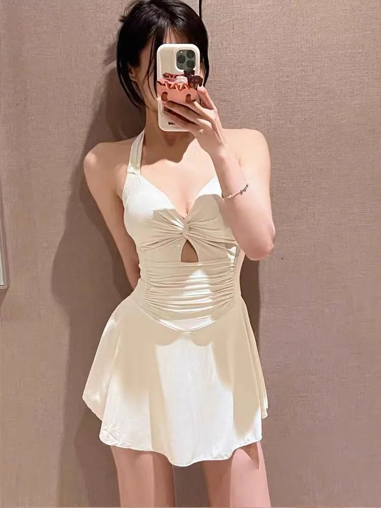 Solid colour one-piece swimsuit for women showing backless conservative design on a mannequin.