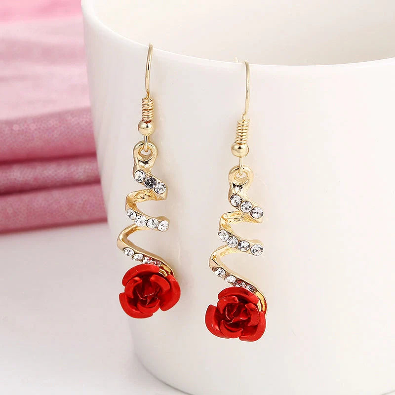 Ethnic red rose drop earrings with big rhinestones in rose gold spiral design