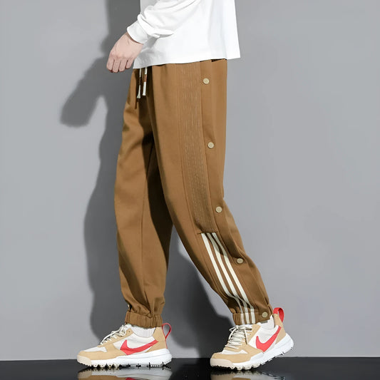 Men's loose fit ankle-tied sweatpants in a cotton blend fabric on a neutral background