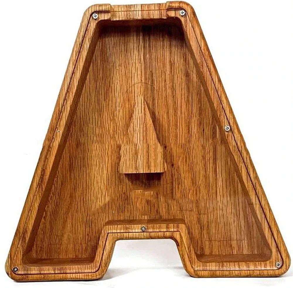 Handmade wooden letter piggy bank with personalised initial, showing 15cm height and 5cm coin slot for UK coins