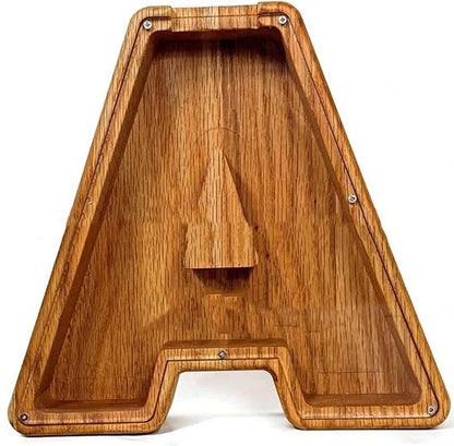 Handmade wooden letter piggy bank with personalised initial, showing 15cm height and 5cm coin slot for UK coins