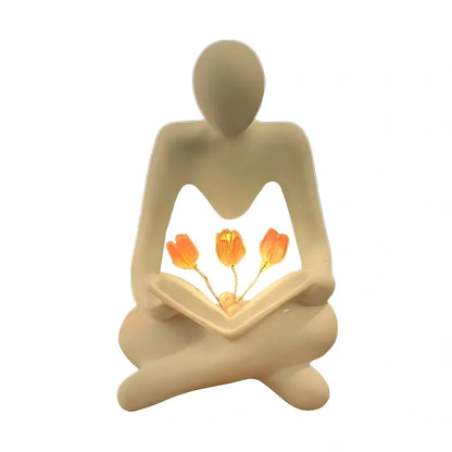Nordic abstract thinker statue with tulip book night lamp measuring 7x6.3x11.5cm