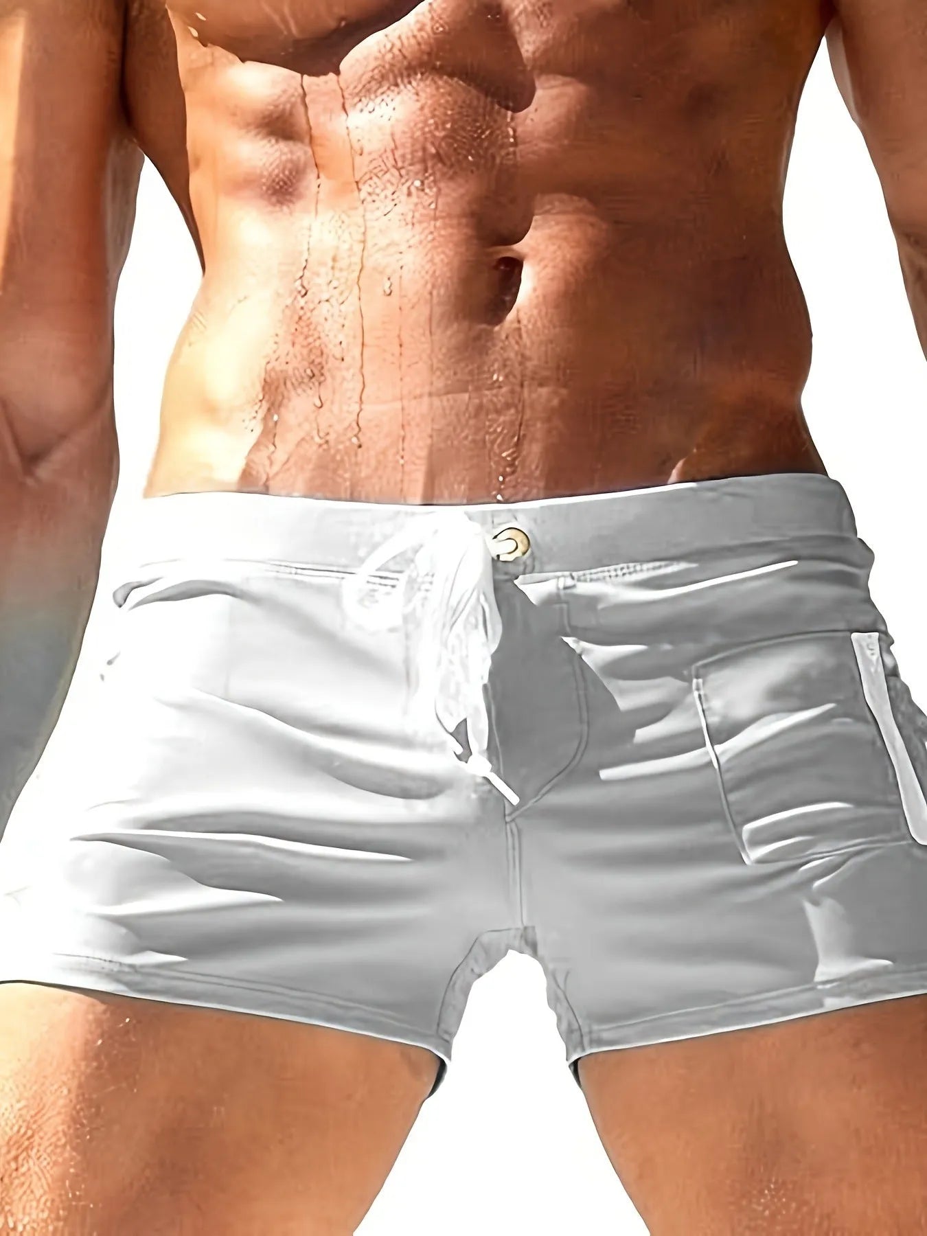 Men's black high-waisted swimming trunks with a white lace-up front closure, laid flat.