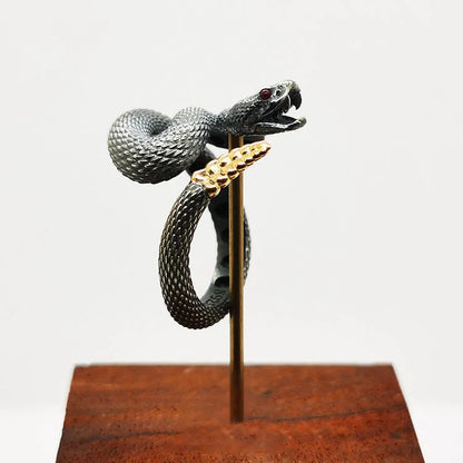 Adjustable snake ring with unique rattlesnake design in various color options, including white and black with open or shut mouth styles, and gold accents