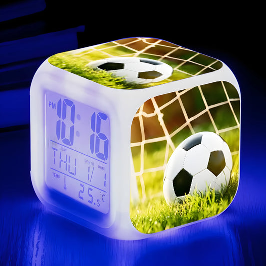 Colourful cartoon football pattern children's mute alarm clock on a table.