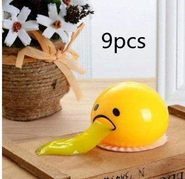 Gudetama Vomiting Egg Toy in green, orange, pink, and yellow for stress relief and fun