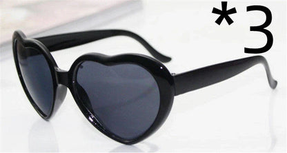 Stylish heart-shaped lighting sunglasses with a plastic frame and resin lenses, creating a mesmerizing effect for romantic occasions