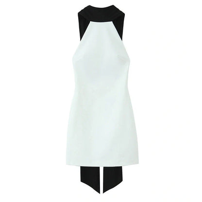 Slim-fitting black patchwork halter dress with asymmetric skirt and high waist detail