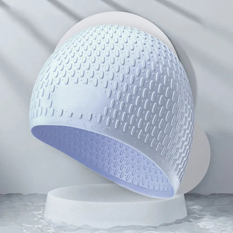 Silicone water drop swimming cap for adults shown in one of nine solid colours.