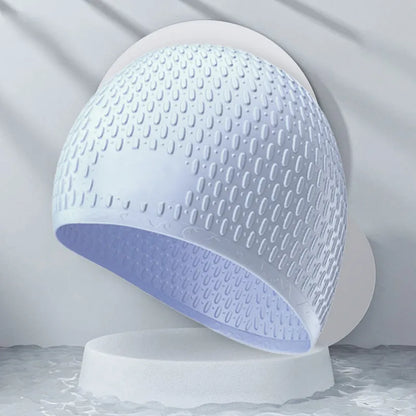 Silicone water drop swimming cap for adults shown in one of nine solid colours.