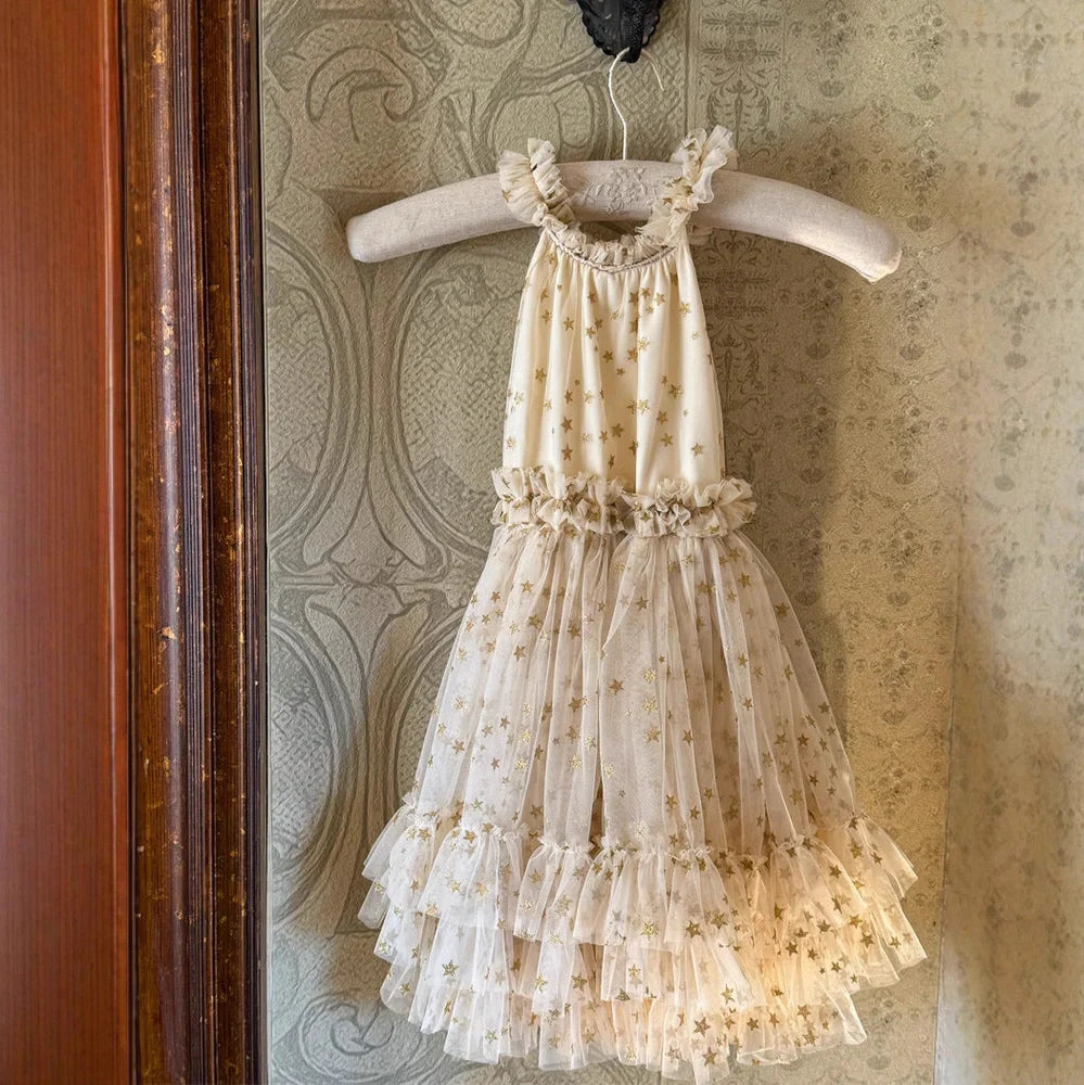 Apricot-coloured girls' halter neck tulle skirt with sleeveless design and floaty appearance