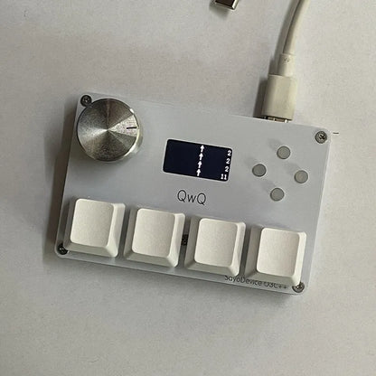 Magnetic axis numeric game keypad with programmable knob and colour screen on desk