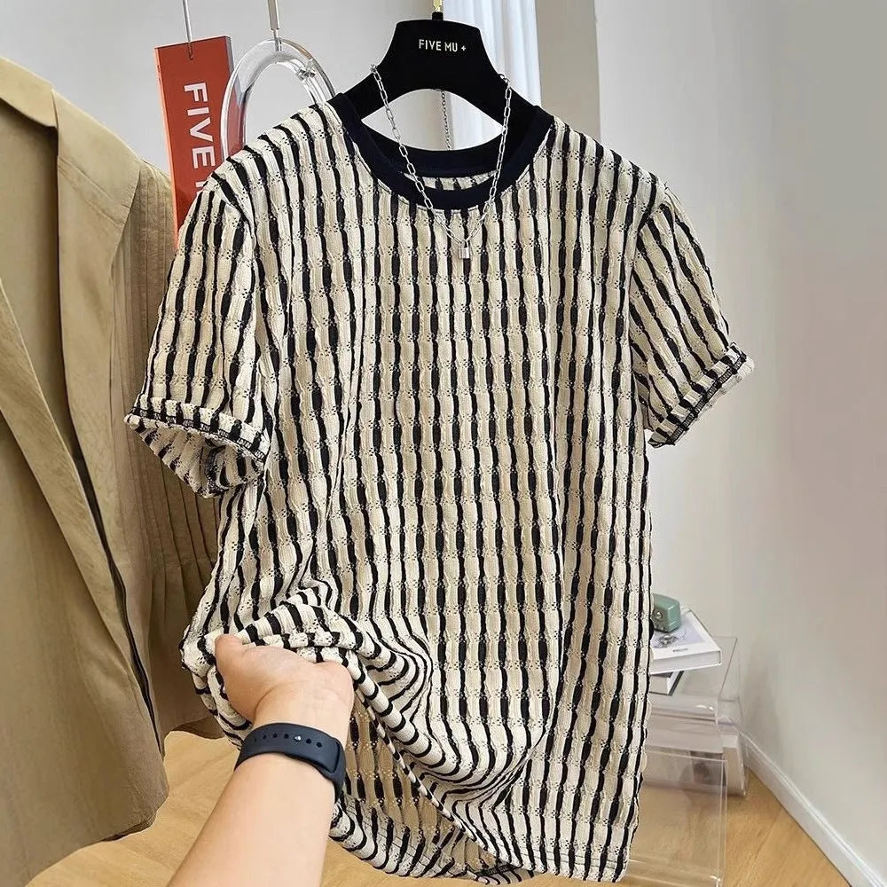 Black and white striped men's loose-fit short sleeve pullover on a hanger