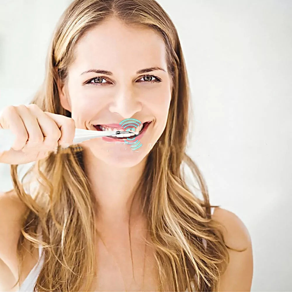 High-frequency electric toothbrush in white and black, with USB charging cable and brush heads