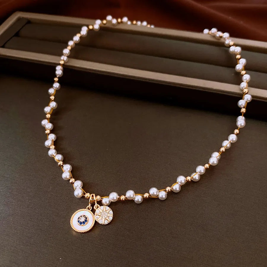 Gold-white necklace with round geometric pendant featuring zircon and imitation pearl on adjustable 41-50cm chain