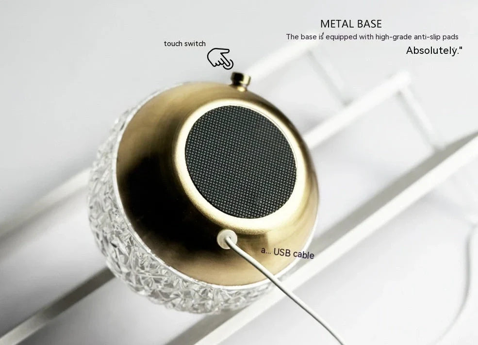 Spherical water ripple projector night light with touch controls creating colourful aurora patterns on wall