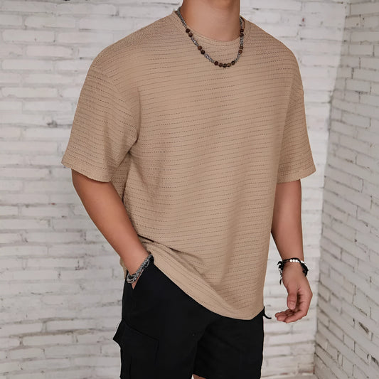 Men's slim-fit solid colour short sleeve T-shirt on a hanger, showing lightweight fabric.